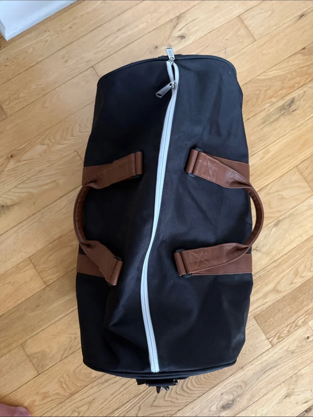 Herschel Supply Company Black Duffel with Brown Straps and White Piping. 43L.